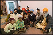 Sikh men and boys in gurdwara. Bharatpur, Rajasthan, India