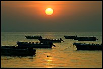 Boats anchored in bay and sunrise, Dona Paula. Goa, India (color)