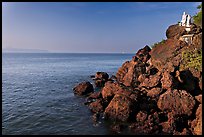 Boulders and christian statues at the edge of ocean, Dona Paula. Goa, India ( color)