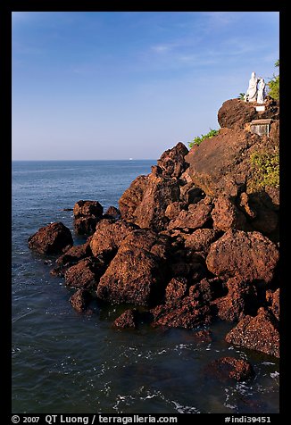 Boulders and christian statues overlooking ocean, Dona Paula. Goa, India
