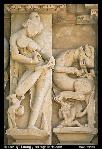 Sculpture of woman removing thorn from foot, Parsvanatha temple, Eastern Group. Khajuraho, Madhya Pradesh, India (color)