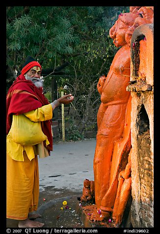 Holy man worshiping Shiva image. Khajuraho, Madhya Pradesh, India (color)