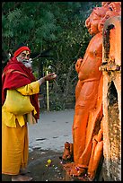 Holy man worshiping Shiva image. Khajuraho, Madhya Pradesh, India (color)
