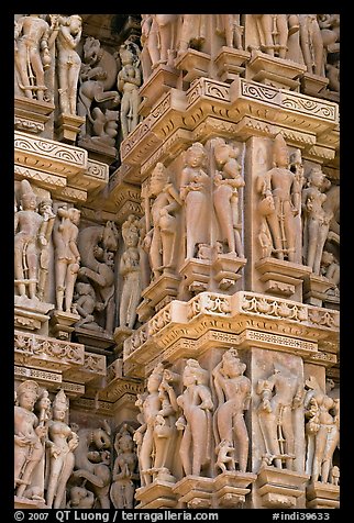 Sculptural details with apsaras, Kadariya-Mahadev temple. Khajuraho, Madhya Pradesh, India (color)