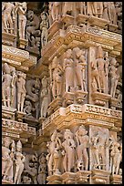 Sculptural details with apsaras, Kadariya-Mahadev temple. Khajuraho, Madhya Pradesh, India