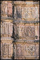 Carvings on the outside of Kadariya-Mahadeva temple including erotic figures. Khajuraho, Madhya Pradesh, India (color)