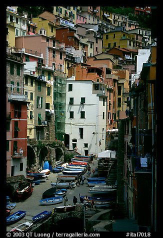 Plazza with parked boats built along steep ravine, Riomaggiore. Cinque Terre, Liguria, Italy