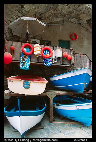 Tiny fishing boats stacked in the main square, Riomaggiore. Cinque Terre, Liguria, Italy