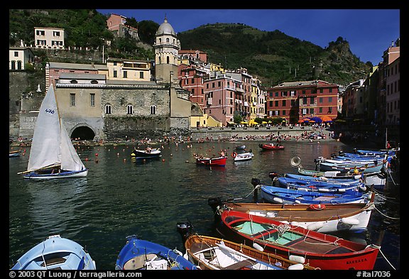 Colorful fishing boats in the harbor and Piazza Guglielmo Marconi, Vernazza. Cinque Terre, Liguria, Italy (color)