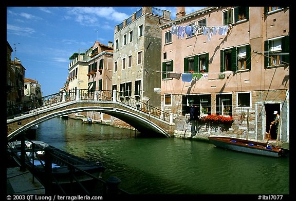 Bridge spanning a canal, Castello. Venice, Veneto, Italy