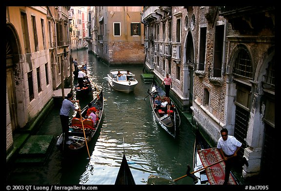 Busy water trafic in  narrow canal. Venice, Veneto, Italy