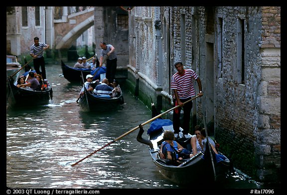 Several gondolas in a narrow canal. Venice, Veneto, Italy (color)