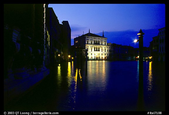 Grand Canal at night with lighted palace. Venice, Veneto, Italy