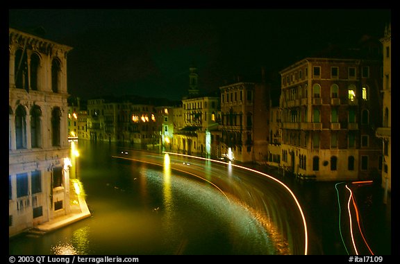 Light trails on the Grand Canal at night near the Rialto Bridge. Venice, Veneto, Italy