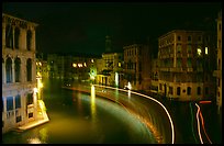 Light trails on the Grand Canal at night near the Rialto Bridge. Venice, Veneto, Italy
