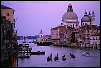 Gondolas, Grand Canal, Santa Maria della Salute church from the Academy Bridge, dusk. Venice, Veneto, Italy (color)