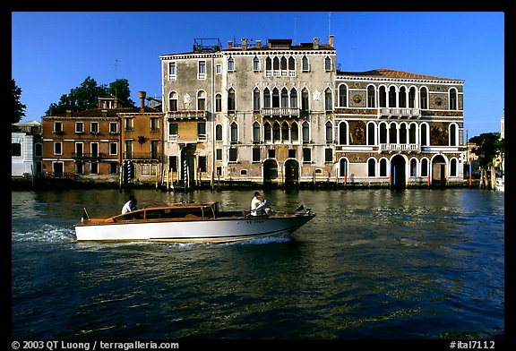 Water taxi passes in front of the Palazzo Dorio on the Grand Canal. Venice, Veneto, Italy
