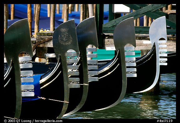Row of gondolas prows, with their characteristic ferri. Venice, Veneto, Italy (color)