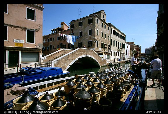 Delivery of wine along a side canal, Castello. Venice, Veneto, Italy (color)