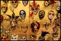 Carnival masks over golden background, Burano. Venice, Veneto, Italy ( color)