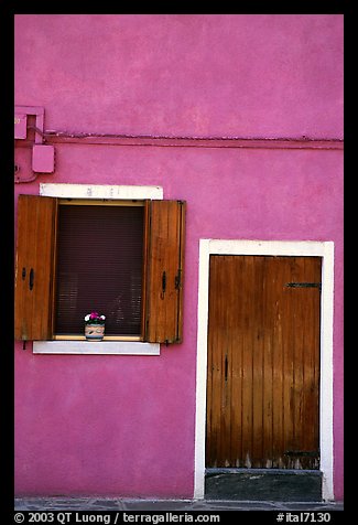 Door, window, pink-colored house,  Burano. Venice, Veneto, Italy