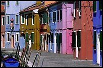 Sidewalk and row of brightly painted houses, Burano. Venice, Veneto, Italy ( color)
