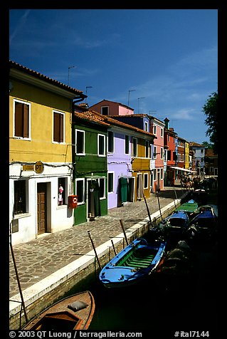 Canal lined with houses painted with bright colors, Burano. Venice, Veneto, Italy