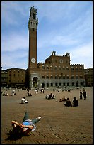 Tourist relaxes on Piazza Del Campo. Siena, Tuscany, Italy ( color)