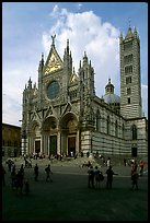 Richly decorated cathedral facade, afternoon. Siena, Tuscany, Italy (color)
