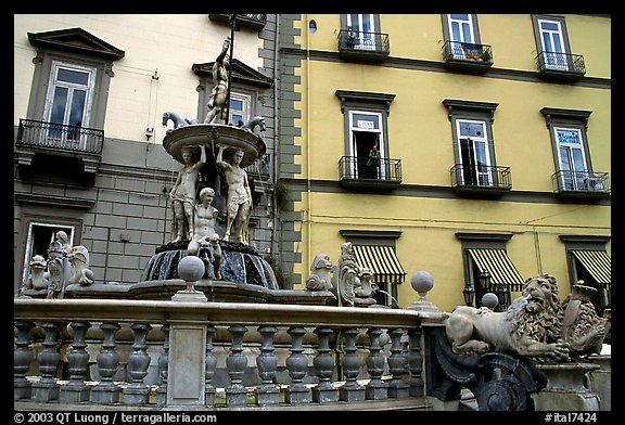 Fountain with man at balcony in background. Naples, Campania, Italy (color)