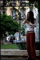 Young woman talking on a cell phone. Naples, Campania, Italy (color)