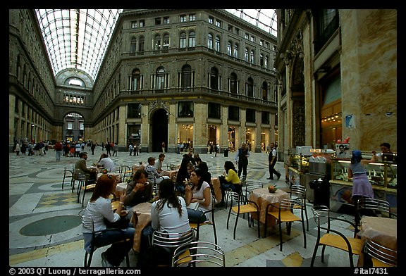 Women enjoy gelato inside the Galleria Umberto I. Naples, Campania, Italy