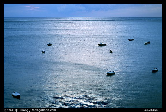 Small boats at sunset in the Gulf of Salerno, Positano. Amalfi Coast, Campania, Italy (color)