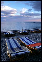 Beach chairs on Spiaggia del Fornillo at sunset, Positano. Amalfi Coast, Campania, Italy