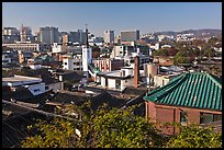 Hanok houses overlooking modern skyline. Seoul, South Korea (color)