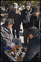 Elderly men play game of baduk (go). Seoul, South Korea (color)