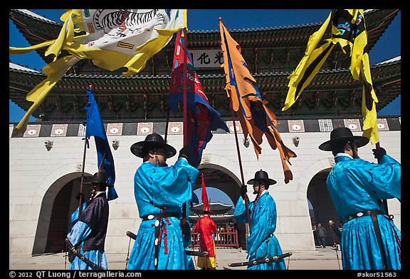 Guards carrying flags in front of main gate, Gyeongbokgung. Seoul, South Korea (color)