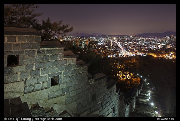 Rampart wall and city lights, Suwon Hwaseong Fortress. South Korea