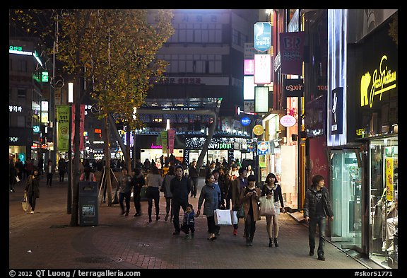 Shoppers strolling on pedestrian street at night. Daegu, South Korea (color)