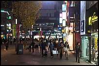 Shoppers strolling on pedestrian street at night. Daegu, South Korea (color)