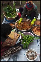 Women mixing traditional fermented kimchee. Gyeongju, South Korea ( color)