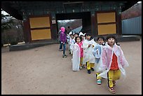 Schoolchildren with raingear, Bulguksa. Gyeongju, South Korea (color)