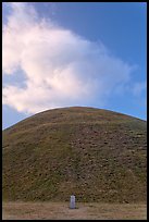 Mound of earth raised over grave and cloud. Gyeongju, South Korea ( color)