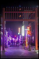 Gate and street with lights at night. Gyeongju, South Korea (color)