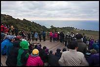Viewers waiting for sunrise on Ilchulbong. Jeju Island, South Korea (color)