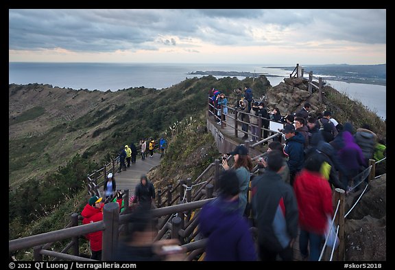 Tourists on top of Seongsang Ilchulbong. Jeju Island, South Korea