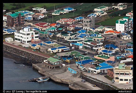 Houses with blue roofs, Seongsang Ilchulbong from above. Jeju Island, South Korea (color)