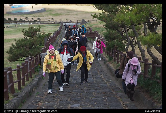 Tourists walking up path, Ilchulbong. Jeju Island, South Korea