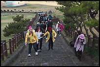 Tourists walking up path, Ilchulbong. Jeju Island, South Korea (color)