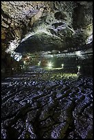 Hardened lava braids on floor of Geomunoreum. Jeju Island, South Korea (color)